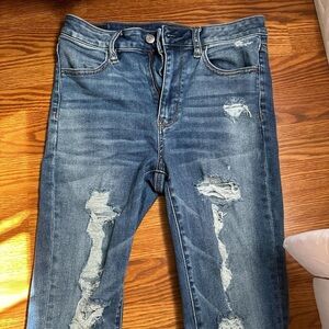 American Eagle navy blue size 8 x-long next level stretch ripped skinny jeans